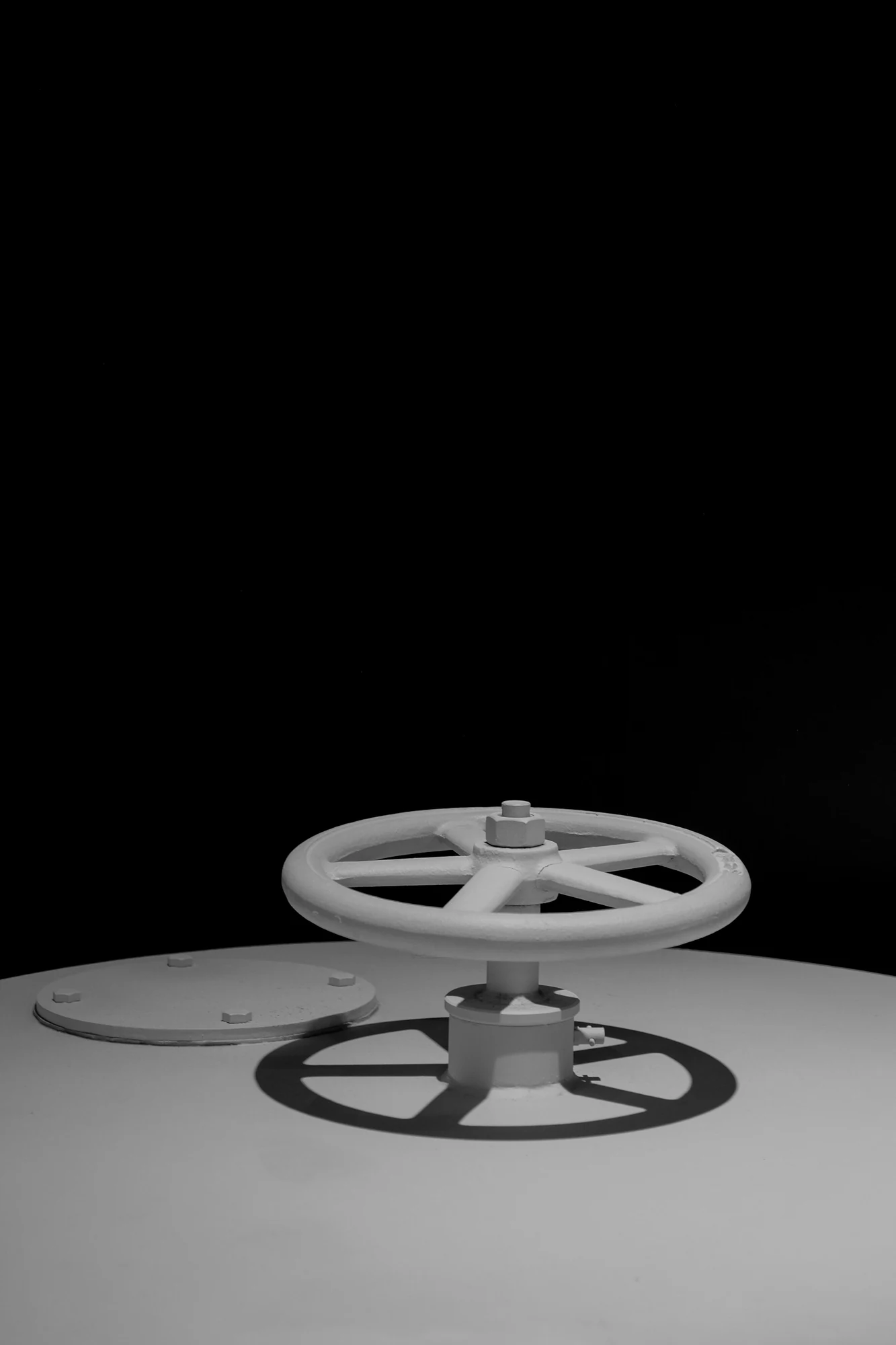 Close-up of an industrial metal handwheel used for low-sulfur flexible graphite specification.