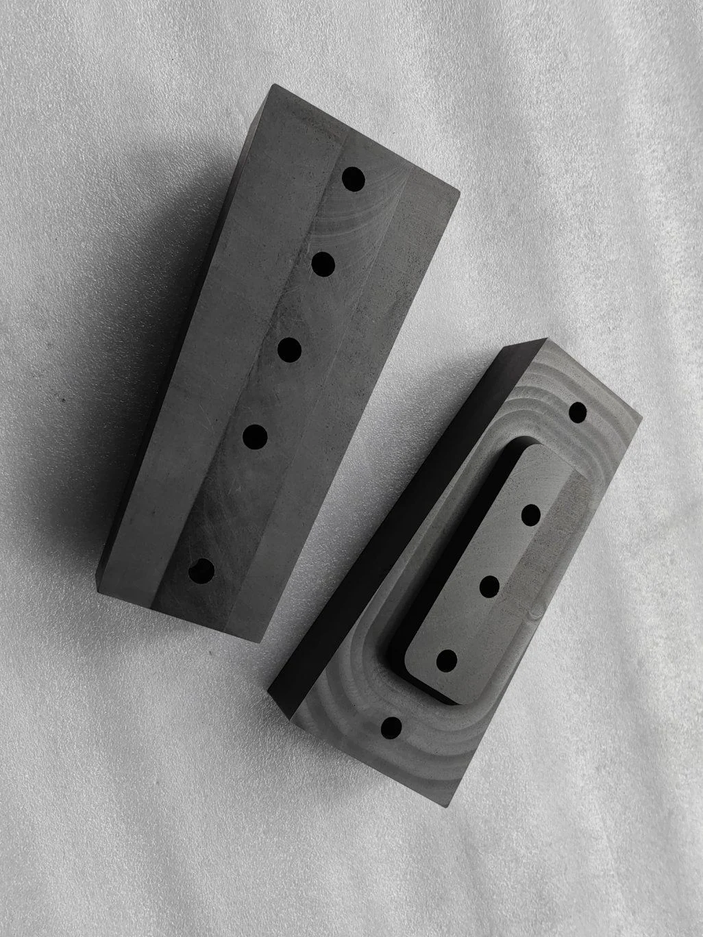 Challenging graphite geometries highlighting thin walls, sharp corners, and chipping risks.